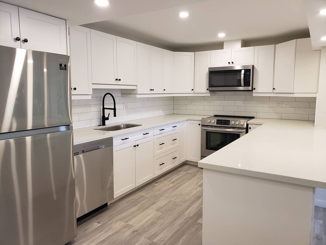 white kitchen with modern appliances